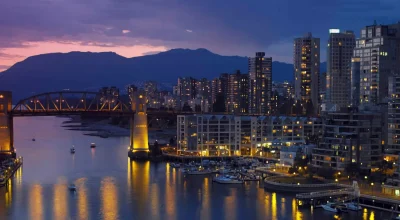 Yaletown and the Burrard Bridge in False Creek in the city of Vancouver, British Columbia in Canada.