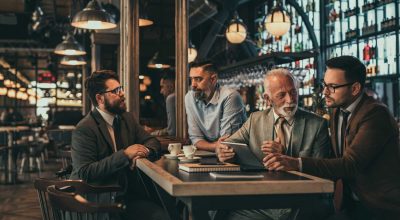 Businessmen socializing at the bar