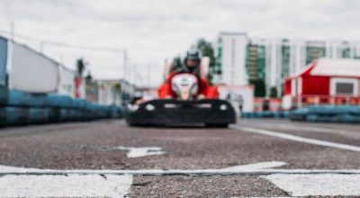 Karting racer on finish line, go kart competition. Carting championship