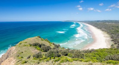 A famous view from Lighthouse Rd over Tallows Beach and Cape Byron in Byron Bay, New South Wales, Australia